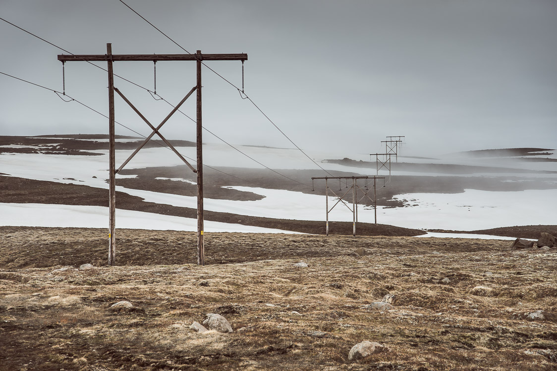 Utility pole in the fog iceland Sebastien Mas